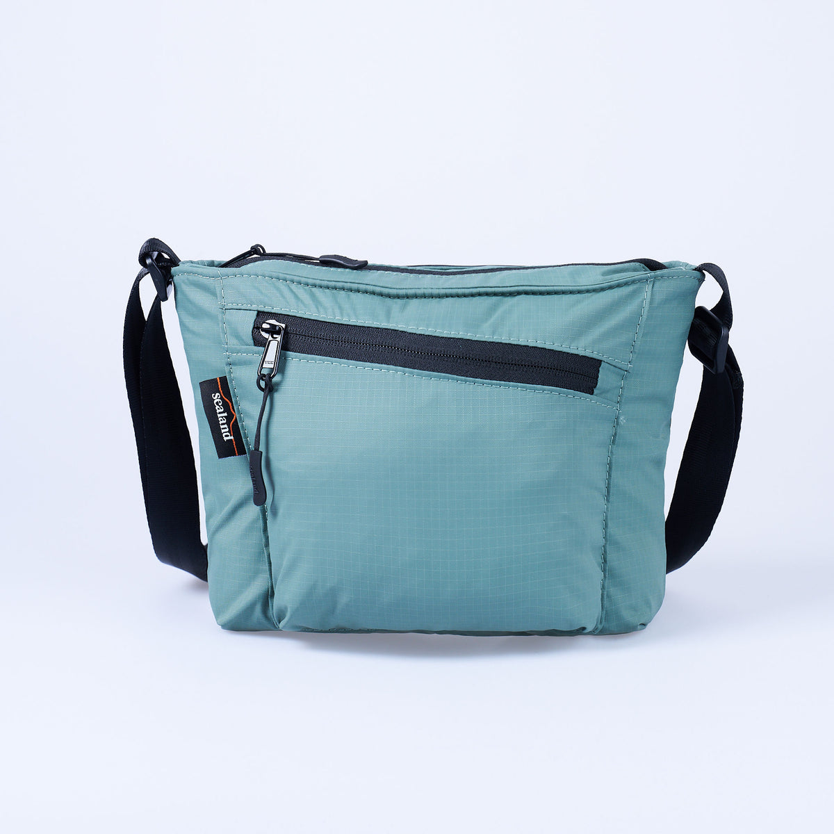 Sealand Wanderer lightweight crossbody bag in recycled ripstop with diagonal front zip in Sage