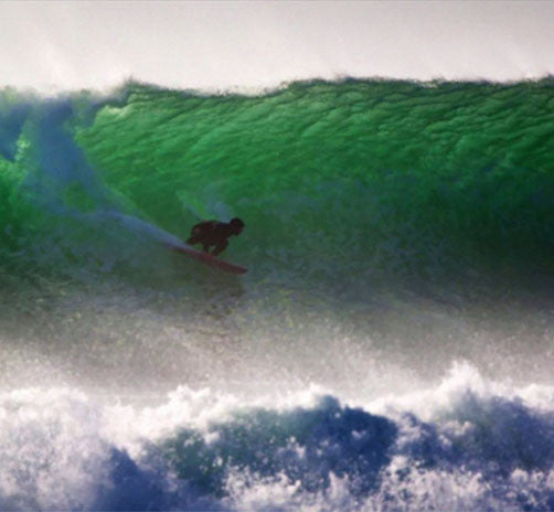 Sacha Specker surfing a wave