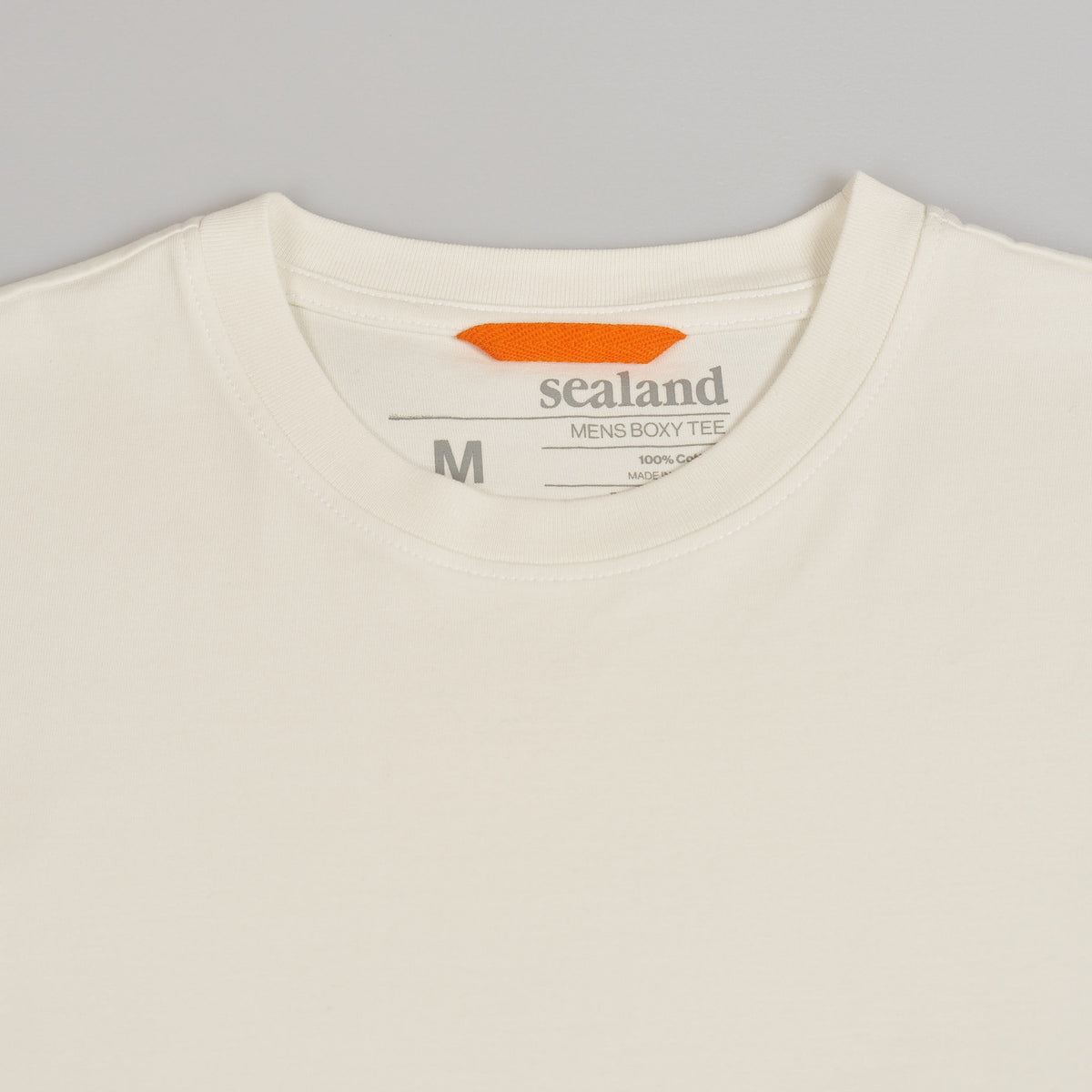 Sealand men's oversized boxy tee in pure white BCI cotton with sleeve branding